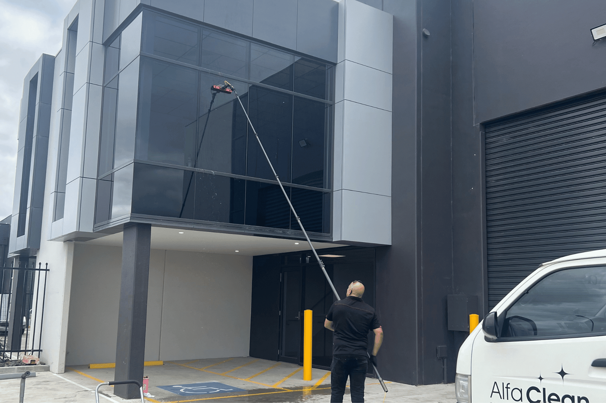 Alfa Clean team performing window cleaning using DI water-fed pole system in Melbourne